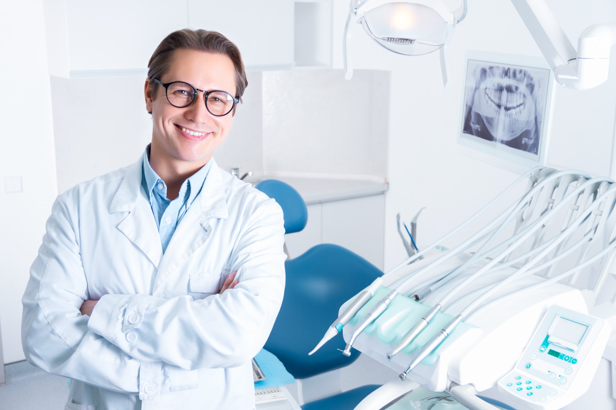 Cheerful male man dentist at dentist office